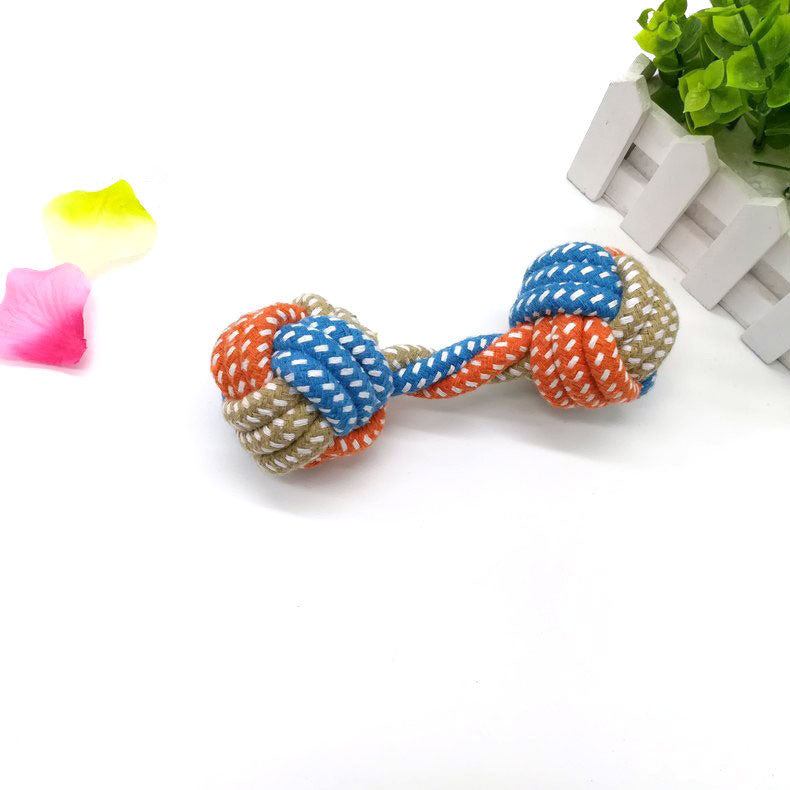 Dog bites cotton rope toy